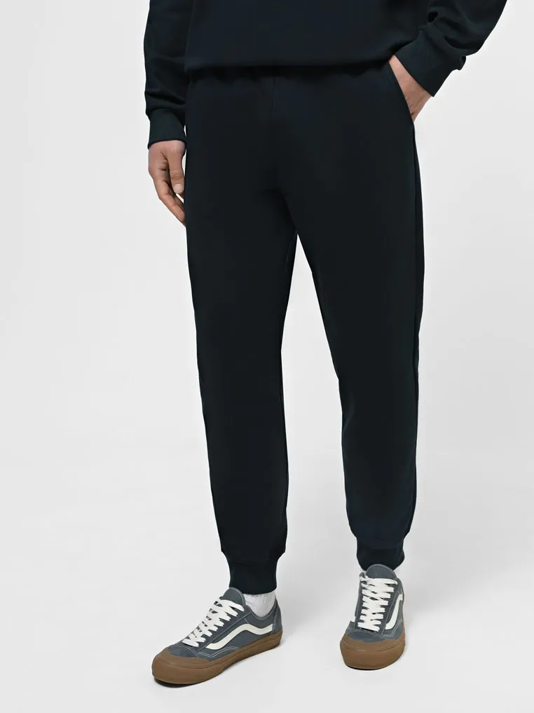 Штани на манжетах